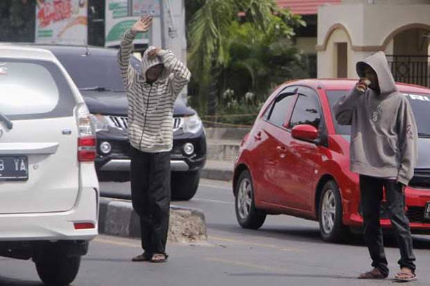 Ilustrasi Pak Ogah menjamur di Pekanbaru (foto/int)